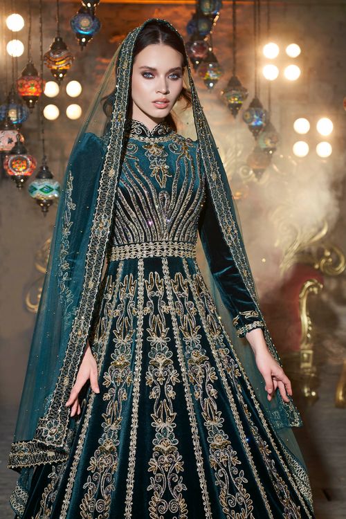 Free Stunning woman in a detailed embroidered caftan, capturing cultural elegance in Izmir Stock Photo