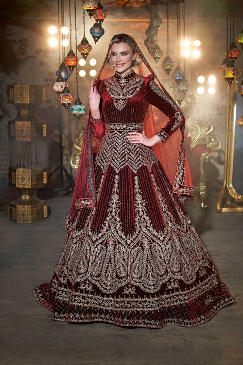 Free Stunning embroidered wedding gown with intricate designs in a vibrant cultural setting. Stock Photo
