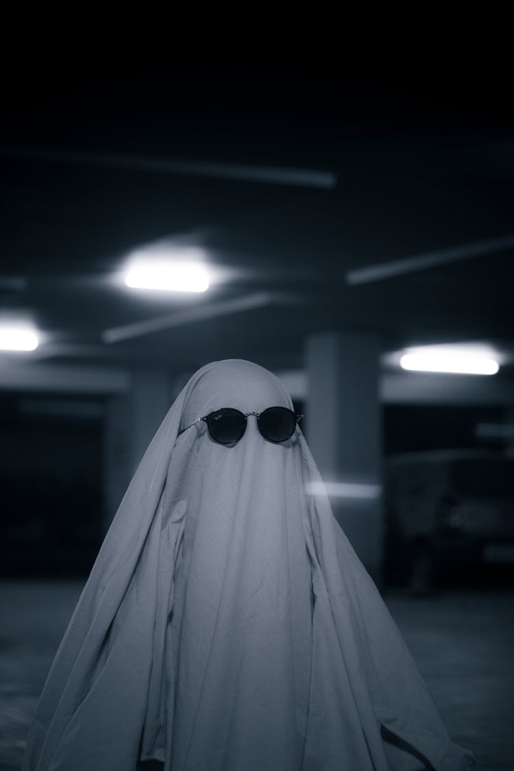 Person Dressed As A Ghost Wearing Sunglasses