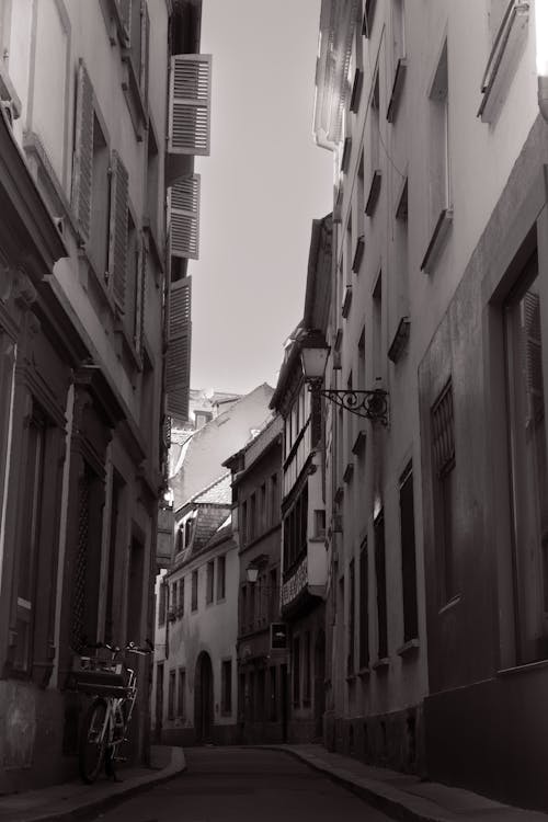 Narrow, Empty Street in Town in Black and White