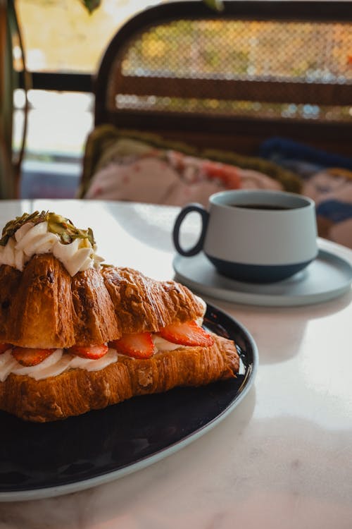 Croissant With Whipped Cream and Strawberries