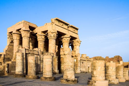 Free Explore the stunning ancient Egyptian temple ruins featuring iconic columns under a clear blue sky. Stock Photo