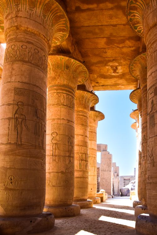 Free Explore this stunning ancient Egyptian temple with intricately carved stone columns. Stock Photo