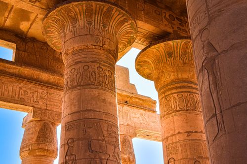 Free Close-up view of ancient Egyptian temple columns with hieroglyphics under daylight. Stock Photo