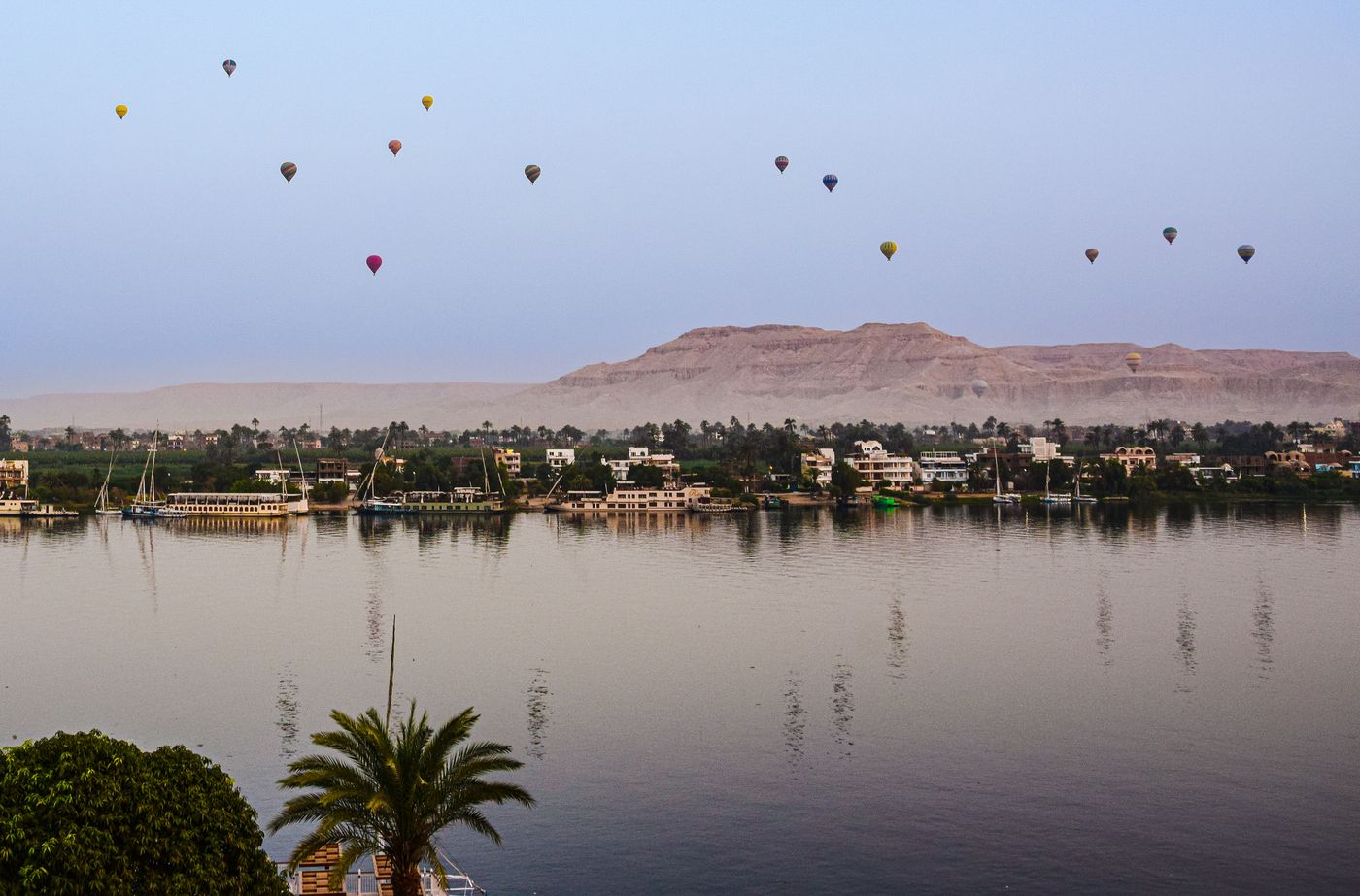 Sun setting behind the West Bank hills across the Nile from Luxor