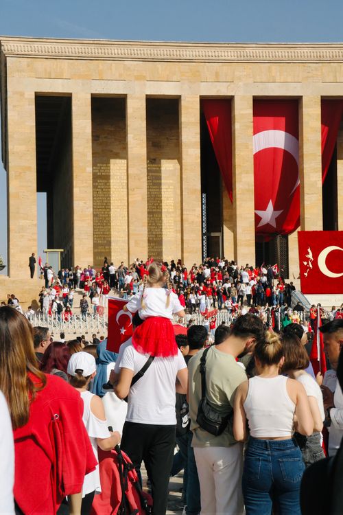 Free People gather with Turkish flags at Anıtkabir, Ankara, showcasing national pride. Stock Photo