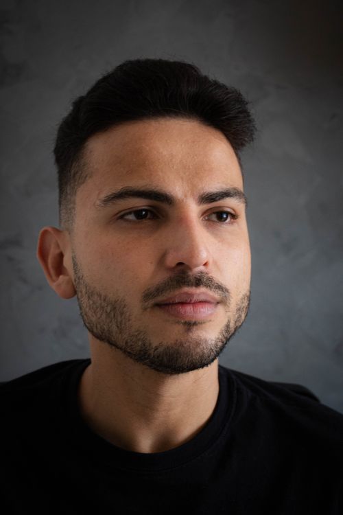 Free Studio portrait of a young man with a beard and thoughtful expression. Stock Photo