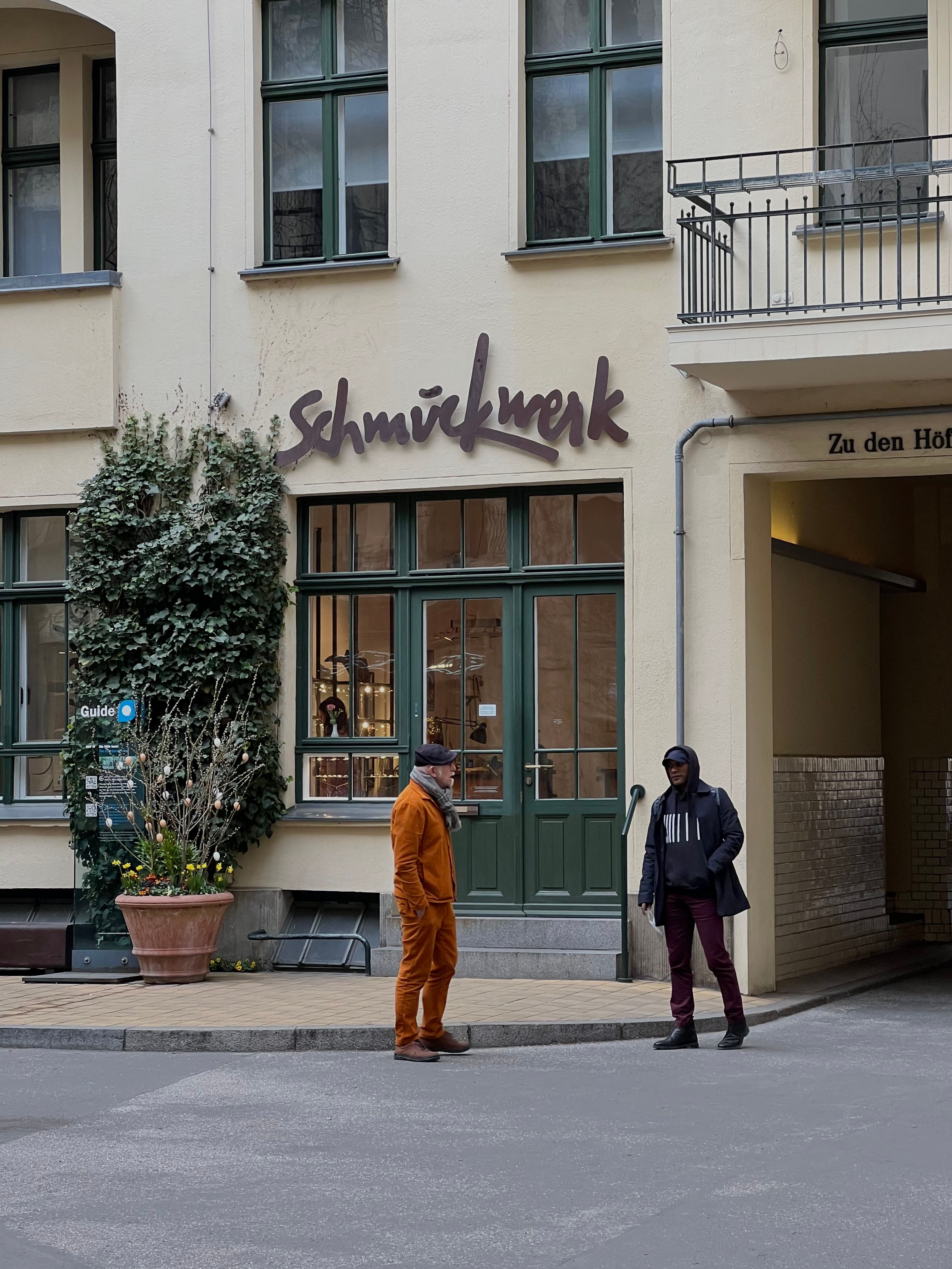 Street view of people and historic architecture captured in a European town.