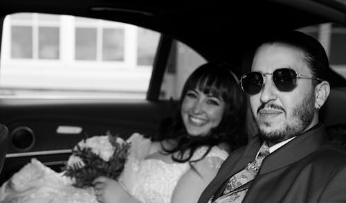 Serene Newlyweds Sitting in Car