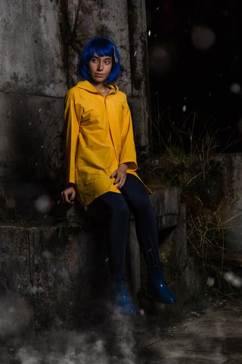 Woman With Blue Hair Wearing Yellow Jacket 