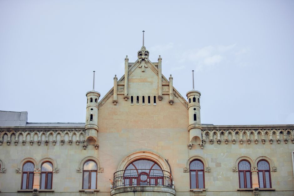Elegant facade of a historic building in Baku, showcasing classic architecture and ornate details.
