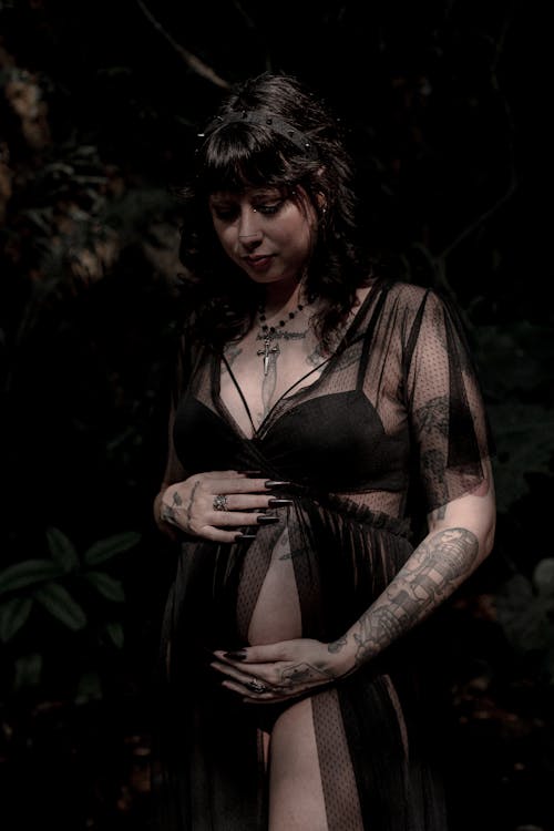 Pregnant Woman with her Hands on her Belly 