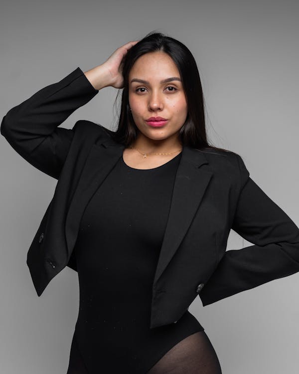 Brunette Woman Posing in Black Cropped Blazer and Bodysuit · Free Stock  Photo