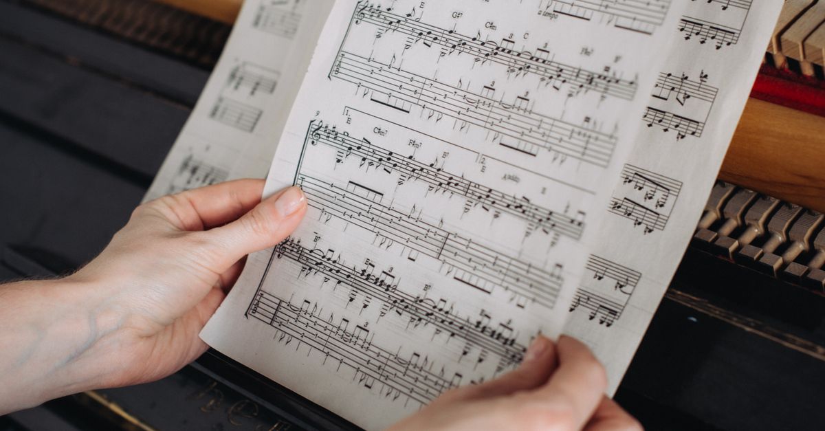 Musical Notes Playying Person Looking at Music Notes for Playing the Piano · Free Stock Photo