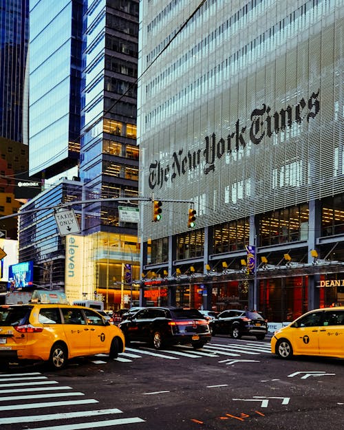 Yellow New York Taxi in front of New York Times Building