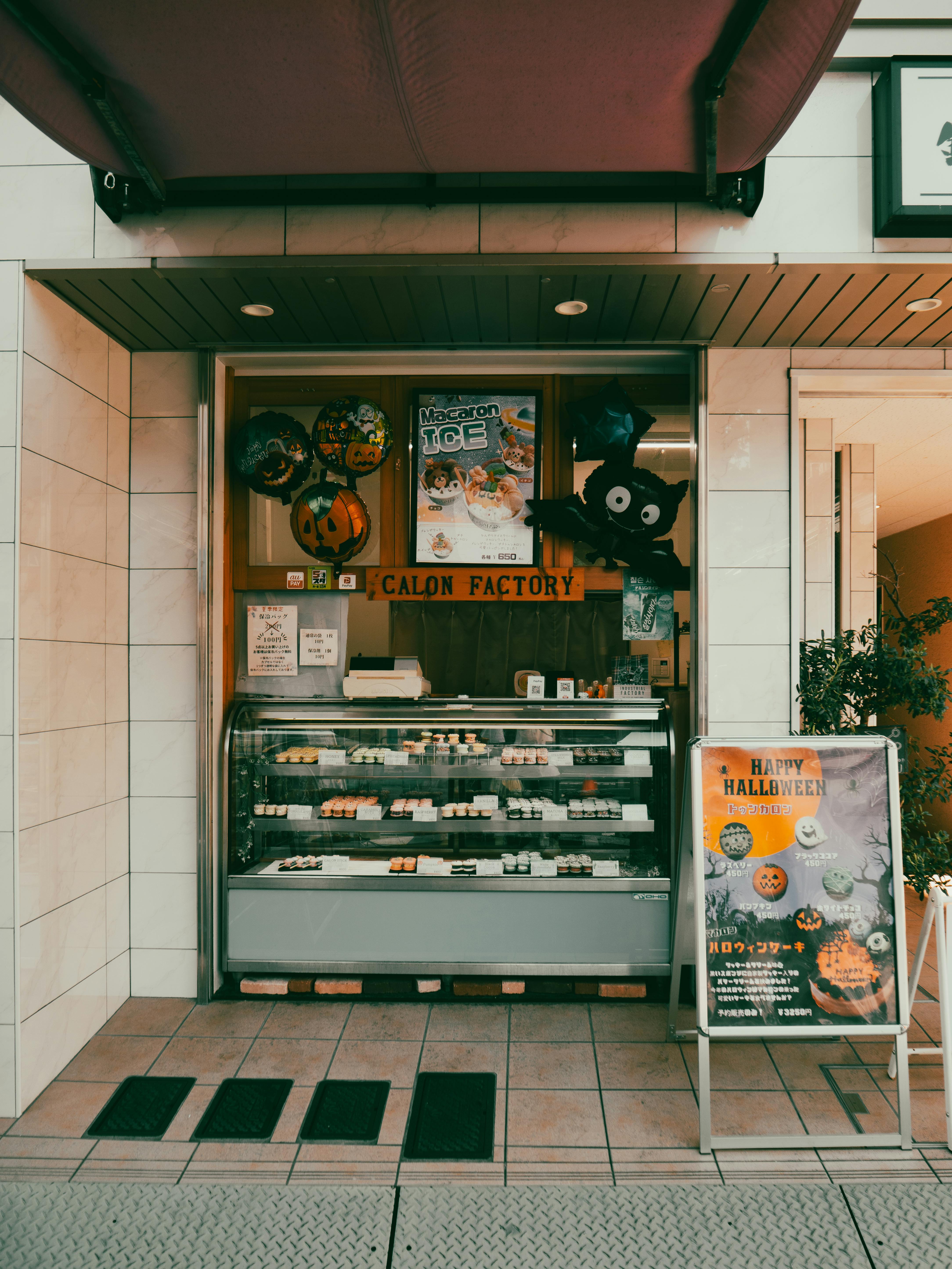 Festive pastry shop in Nagoya, Japan decorated for Halloween showcasing baked goods.