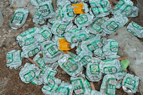 Crushed Beer Cans on Ground