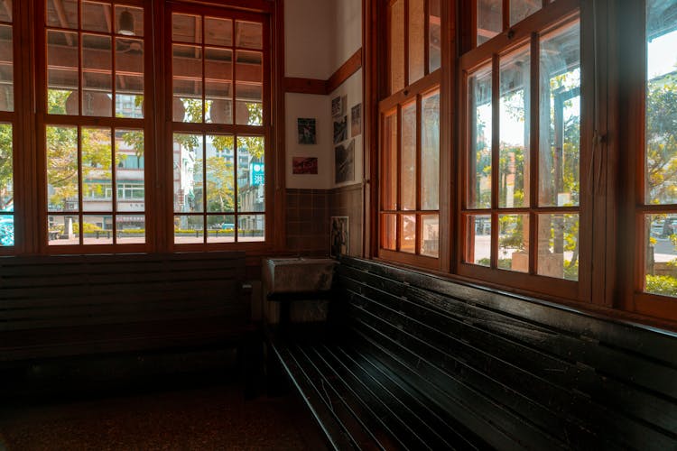 Empty Bench Under Wooden Windows