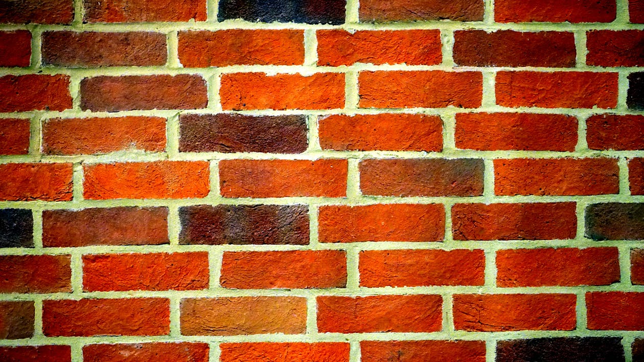 A brick wall section with new mortar joints