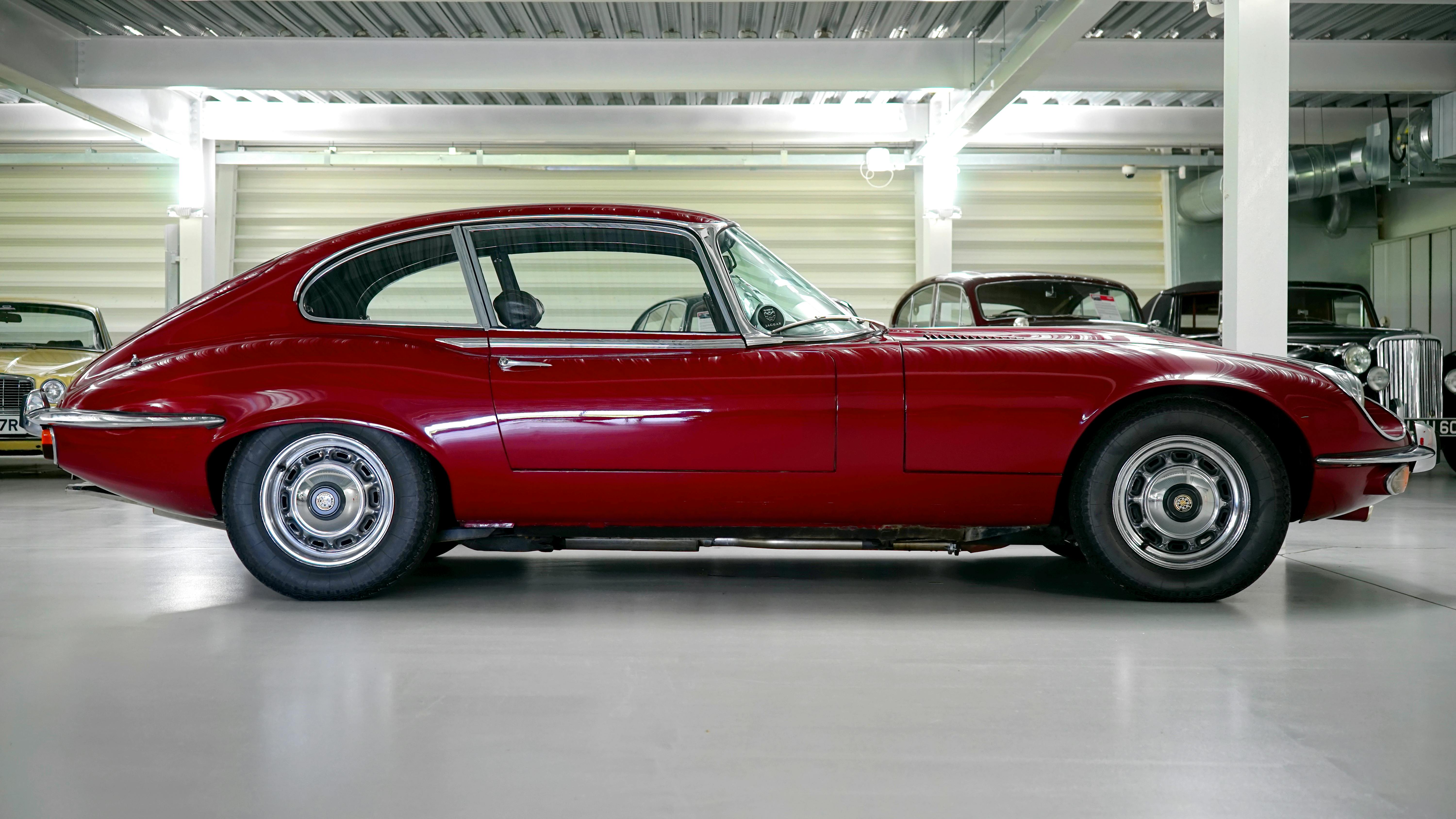 black red classic car in a garage