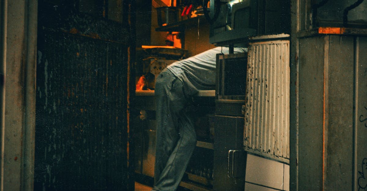Man Leaning on Counter in Kitchen · Free Stock Photo