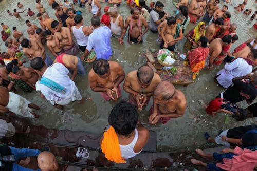 Men in Ritual in Water