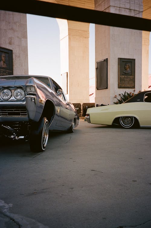 Vintage American Cars Parked in front of a Building with Columns 