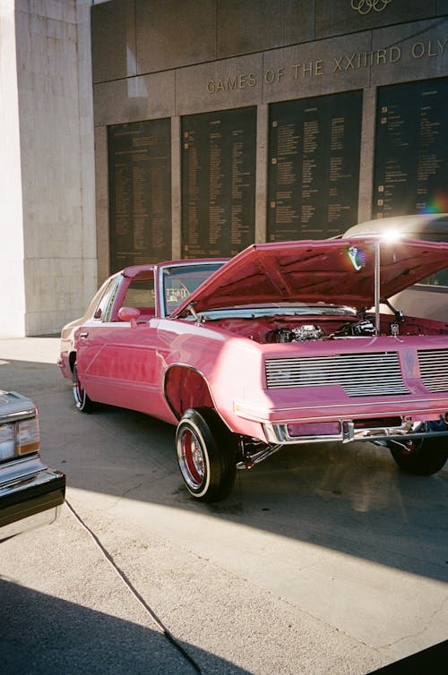 Pink Vintage Car with an Open Hood