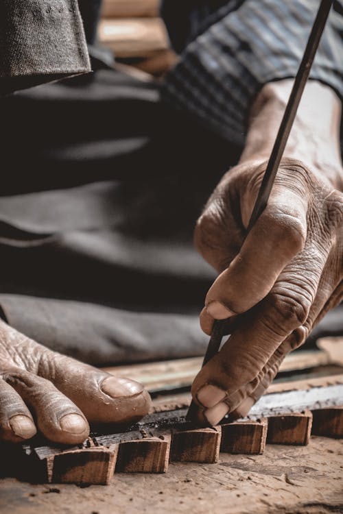 Closeup of a Carpenter Working on a Wooden Frame