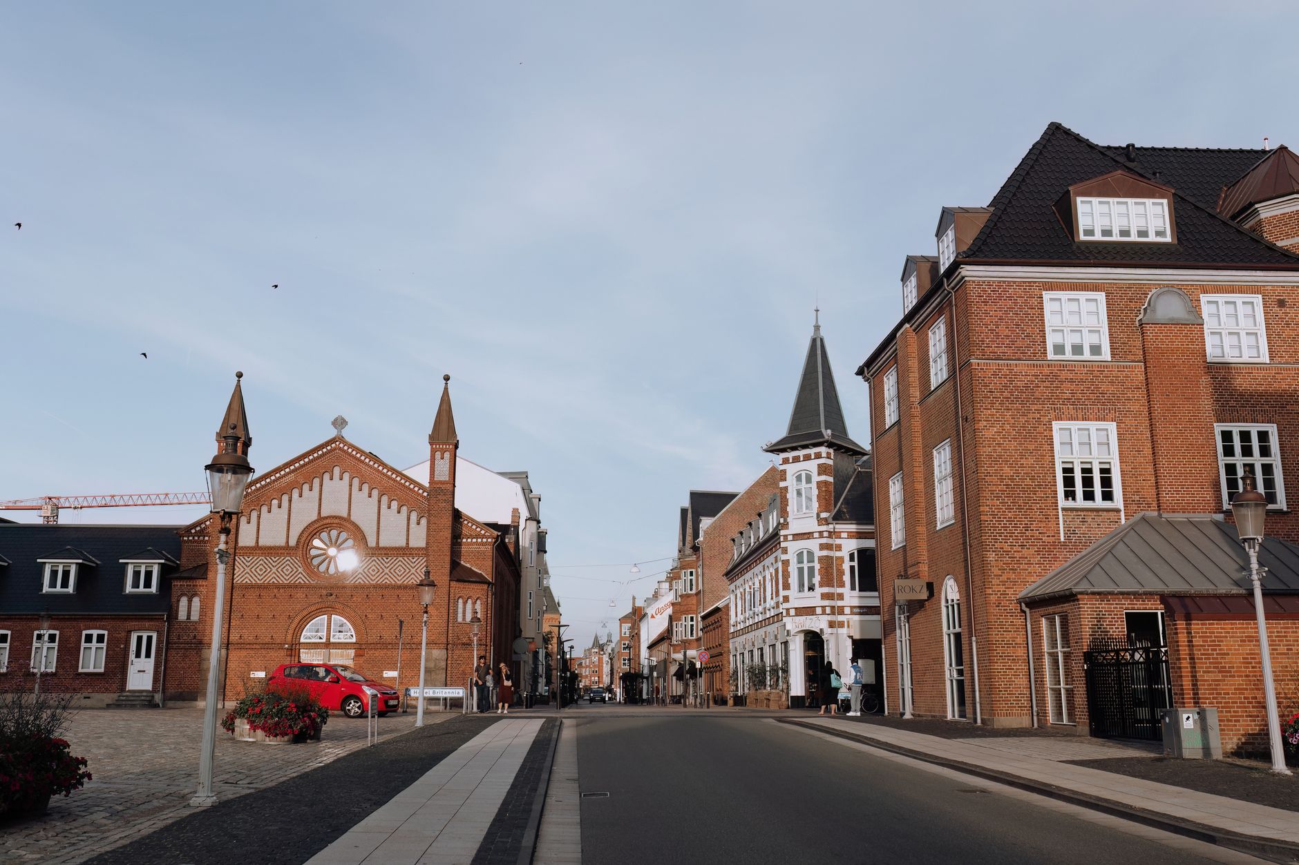 Discover the historic architecture of Esbjerg's old town with red brick buildings and a town square.