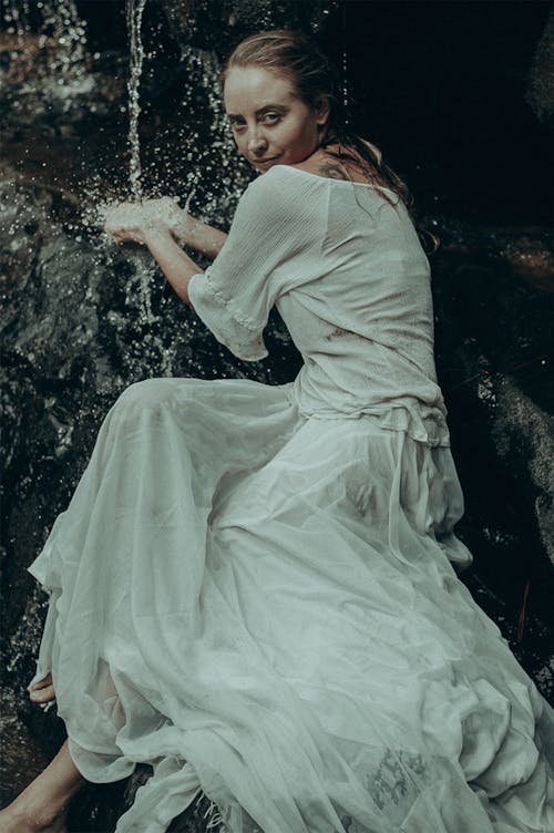 Woman Wearing White Dress by the Stream 