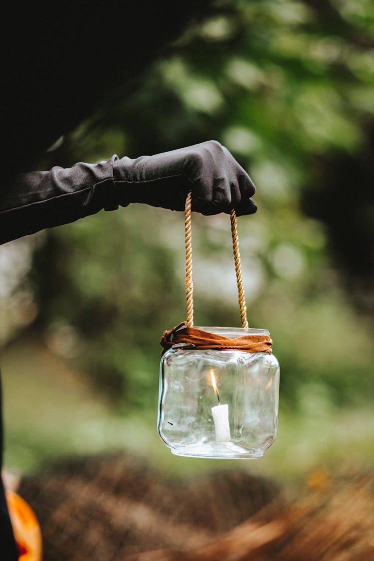 Hand In Leather Glove Holding Lantern