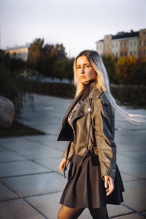 Blonde Woman Wearing Leather Jacket on a Square 