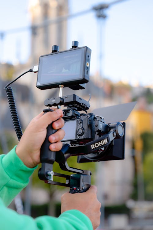 Man Holding a Professional Video Camera Rig