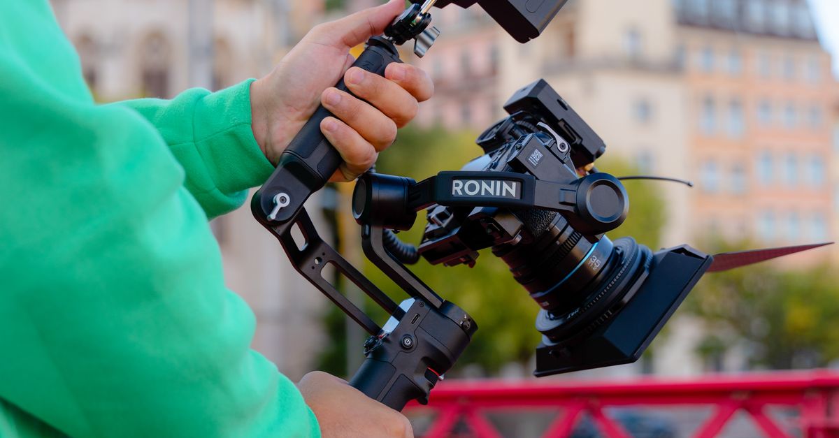 Camera Operators Outside Close-up of a Man Operating a Camera Outside in City · Free Stock Photo