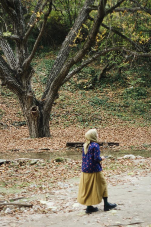 Woman with a Headscarf Walking in the Park 