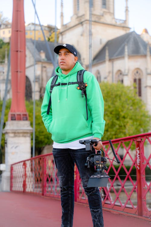 Man Holding a Professional Camera 