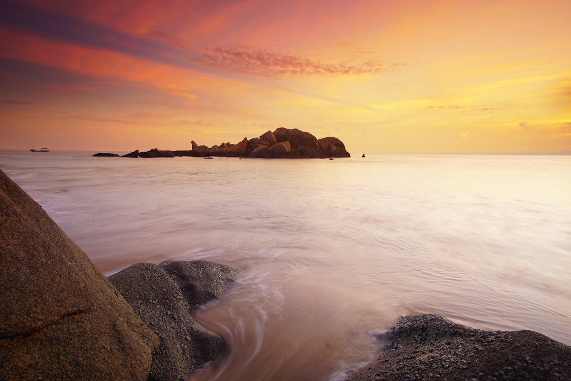 Body of Water Under Sunset