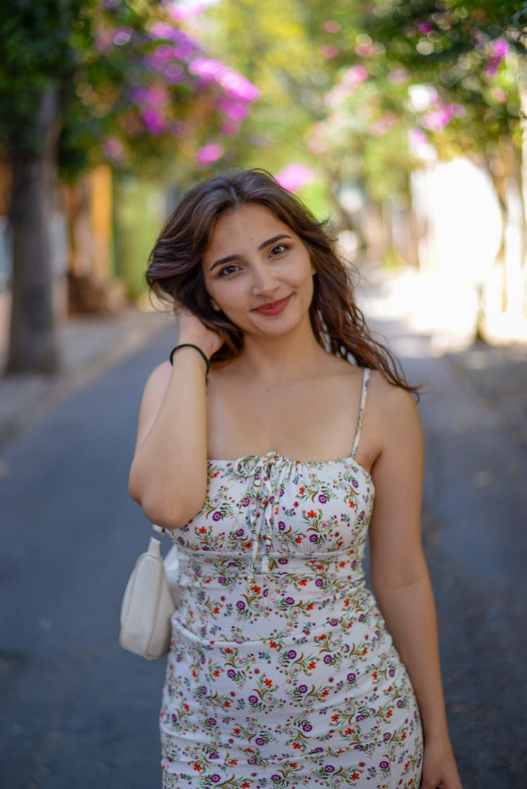 Portrait Of Smiling Woman In White Sundress