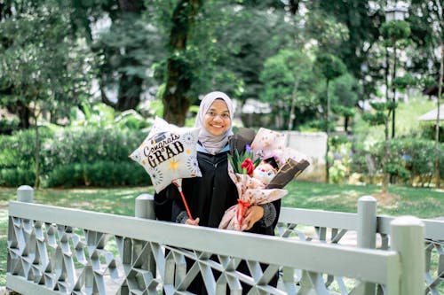 Smiling Graduate in Park