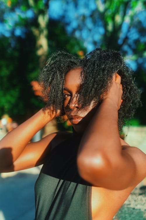 Portrait of Woman Fixing Hair