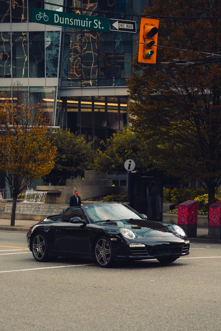 Porsche 911 Carrera Driving On City Street