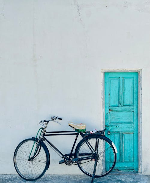 Bike by White Building Wall