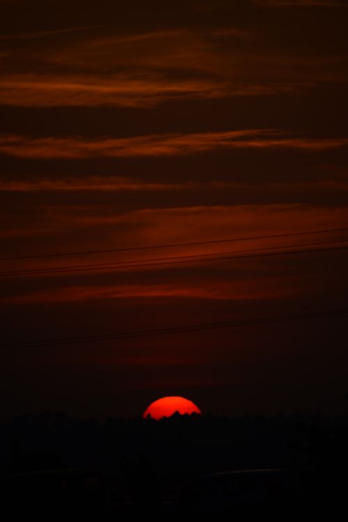 Free Capture the fiery sunset sky in Pullu, India with a stunning silhouette view. Stock Photo