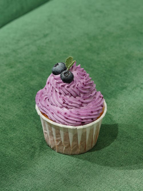 A Cupcake with Blueberry Frosting 
