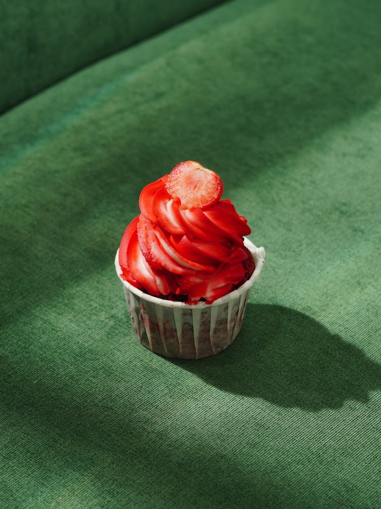  A Cupcake With Strawberry Frosting 