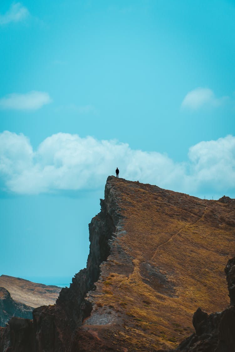 Man On A Rocky Cliff