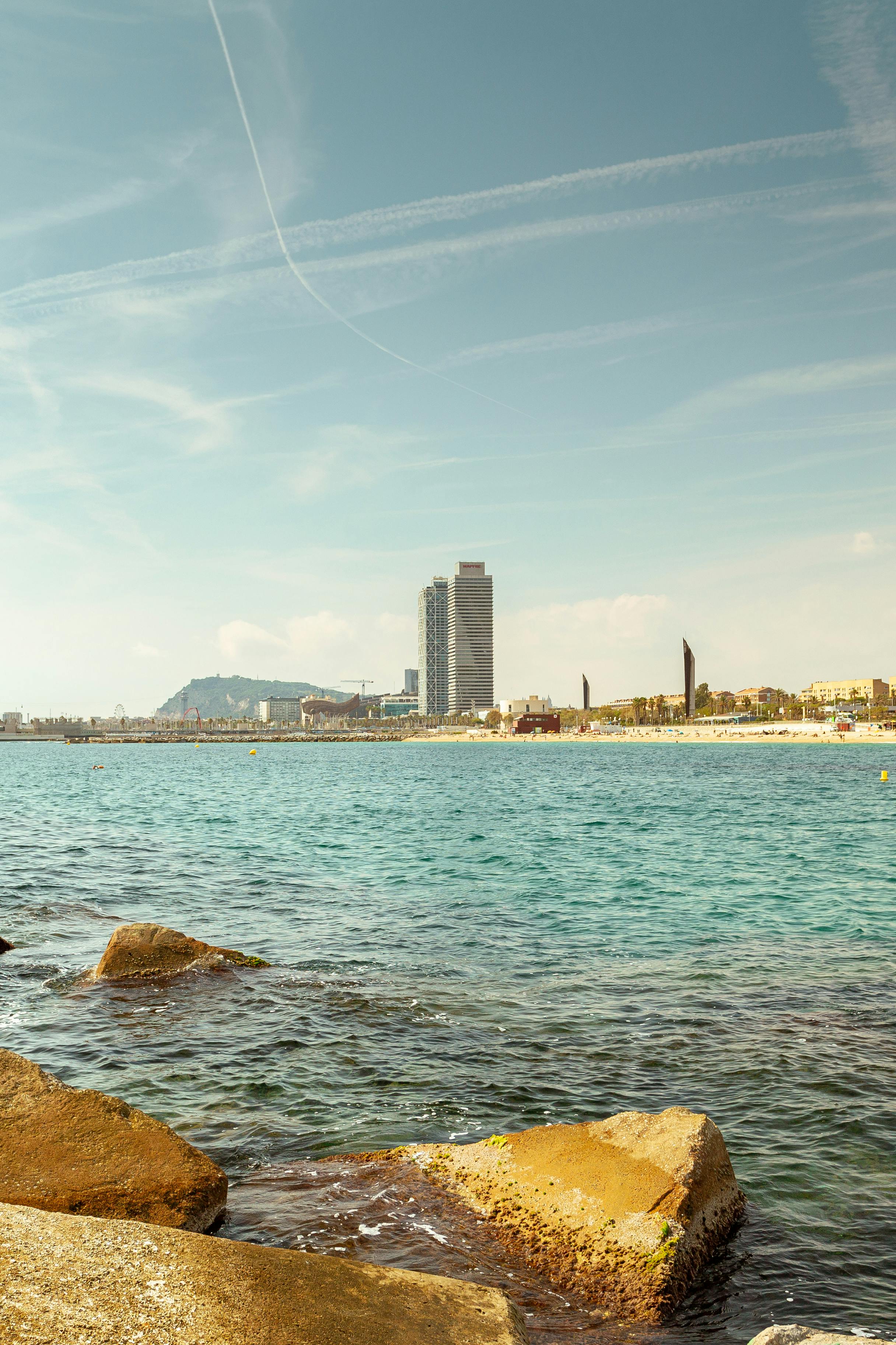 two skyscrapers at beach in barcelona