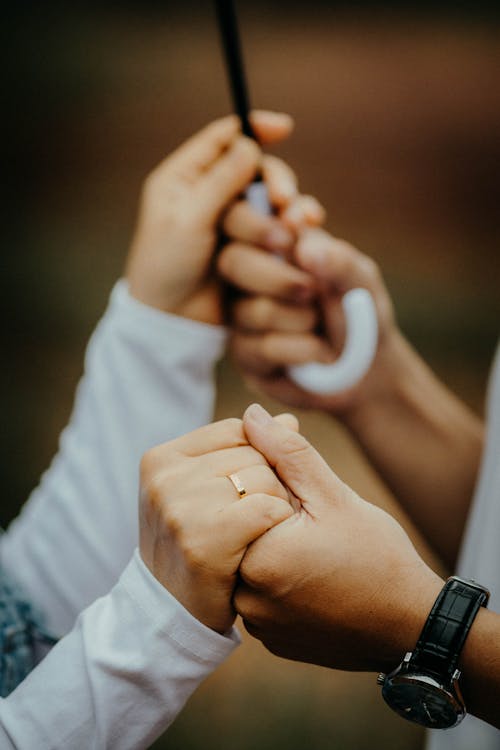 Close up of Woman and Man Holding Hands