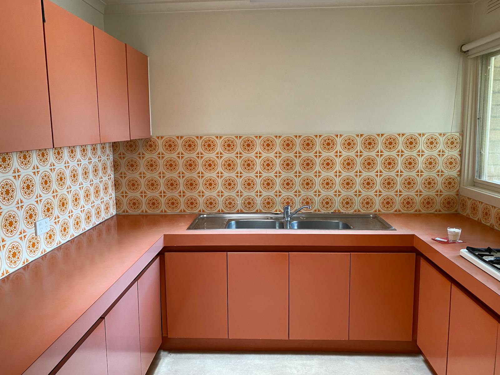 Kitchen — before remodel (dated cabinetry)
